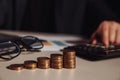 Businessman calculate profit and stack of coins. Investment concept Royalty Free Stock Photo