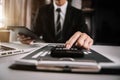 Businessman calculates financials with graph paper on the table on the cost of home office. Royalty Free Stock Photo