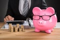 Businessman Calculating Tax On Desk