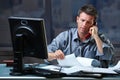 Businessman on call in overtime Royalty Free Stock Photo