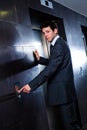 Businessman calling elevator Royalty Free Stock Photo