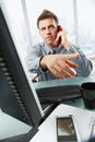 Businessman calling and gesturing in office Royalty Free Stock Photo