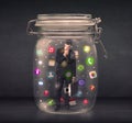 Businessman captured in a glass jar with colourful app icons con