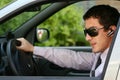 Businessman in car with blue-tooth