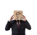 businessman with cardboard box on head having headache Royalty Free Stock Photo