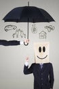 Businessman with cardboard head under umbrella Royalty Free Stock Photo