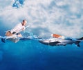 Businessman on a cardbox in the ocean looks for an help. Help with deception concept Royalty Free Stock Photo