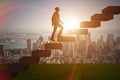 The businessman in career promotion concept with stairs Royalty Free Stock Photo