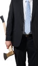 Businessman carrying an axe to do the chopping