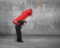 Businessman carrying big red arrow sign with business concept do Royalty Free Stock Photo