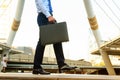 Businessman carrying briefcase in action to start working forw