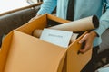 Businessman carrying a brown cardboard box to resignation Royalty Free Stock Photo