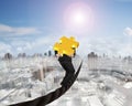 Businessman carrying 3D gold puzzle piece balancing on wire