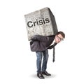 Businessman carrying a heavy stone labeled Crisis Royalty Free Stock Photo