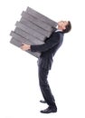 Businessman carrying high burden