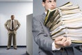 Businessman carrying lots of files Royalty Free Stock Photo