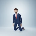 Businessman cartoon character kneeling