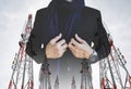 Businessman in casual suit with multiple exposure Telecommunication towers with TV antennas and satellite dish