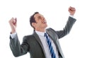 Businessman celebrating success with arms up