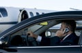 Businessman on cell phone in luxury car Royalty Free Stock Photo