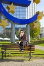 Businessman with cell phone sitting on a bench Royalty Free Stock Photo