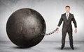 Businessman chained to large ball Royalty Free Stock Photo