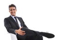 Businessman, chair and relaxing in portrait, studio and smiling for career pride by white background. Male professional Royalty Free Stock Photo