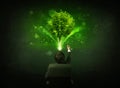 Businessman in chair sitting in front of a glowing tree Royalty Free Stock Photo