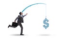 The businessman chasing money on fishing rod Royalty Free Stock Photo