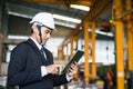 Businessman check stock in factory by tablet Royalty Free Stock Photo