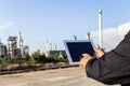 Businessman checking around oil refinery plant with clear sky