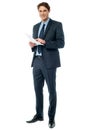 Businessman checking data printed on the list Royalty Free Stock Photo