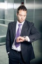 Businessman checking time Royalty Free Stock Photo