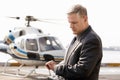 Businessman Checking Time At The Helicopter Pad Royalty Free Stock Photo