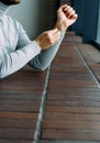 Businessman checking time on his wrist watch, man putting clock on hand,adjust watchband Royalty Free Stock Photo