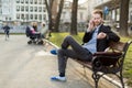 Businessman checking the time looking at his watch on a sunny da