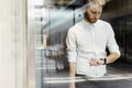 Businessman checking watch while standing in elevator