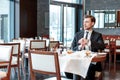 Businessman checks time at his watch Royalty Free Stock Photo