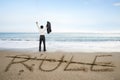 Businessman cheering with rule word deleted line on sand beach Royalty Free Stock Photo