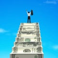 Businessman cheering on top of money stairs Royalty Free Stock Photo