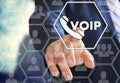 The businessman chooses VOIP on the virtual screen in social network connection Royalty Free Stock Photo