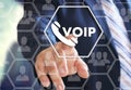 The businessman chooses VOIP on the virtual screen in social network connection Royalty Free Stock Photo