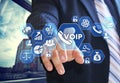 The businessman chooses VOIP on the virtual screen in social net Royalty Free Stock Photo