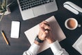 Businessman with clasped hands over work desk, top view Royalty Free Stock Photo