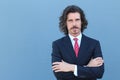 Businessman in classic suit with salt and pepper long hair Royalty Free Stock Photo