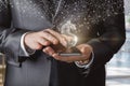 A businessman clicks on phones a hologram of a dollar sign appears