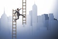 The businessman climbing career ladder in business concept Royalty Free Stock Photo