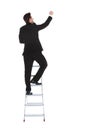 Businessman climbing career ladder Royalty Free Stock Photo