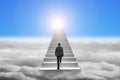 Businessman climbing the concrete stairs with blue sky sunlight Royalty Free Stock Photo