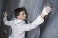 Businessman Climbing Indoor Wall